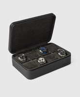 The Fraser 8 Watch Case - Black by TAWBURY holds up to eight wristwatches. This open leather case from their collection showcases a padded interior, perfect for collectors. Each watch spot offers distinct style and color, catering to diverse tastes.